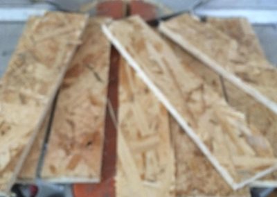 Cut strips of wood for drywall backing
