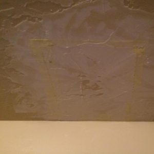 Apply joint compound over the drywall tape