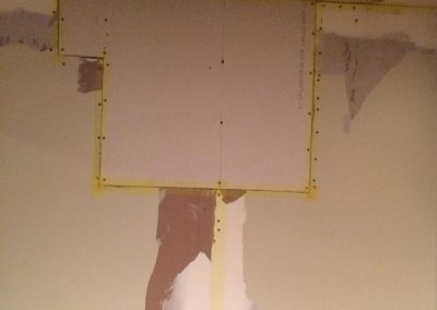 Sheetrock patch ready for texture.